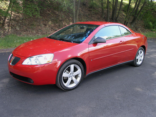 Illustration for article titled Anyone Remember That Time Pontiac Made a Hardtop Convertible?